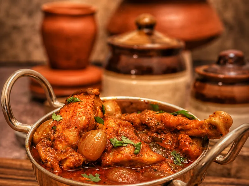 Traditional cooking process with aromatic spices and flames